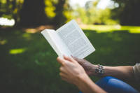 Hands holding book reading