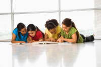 Girls reading with link to homework help page