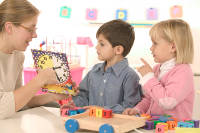 Teacher with boy and girl