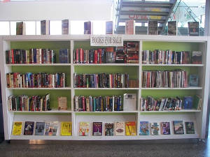 Used book sale shelves at Sam Garcia Library